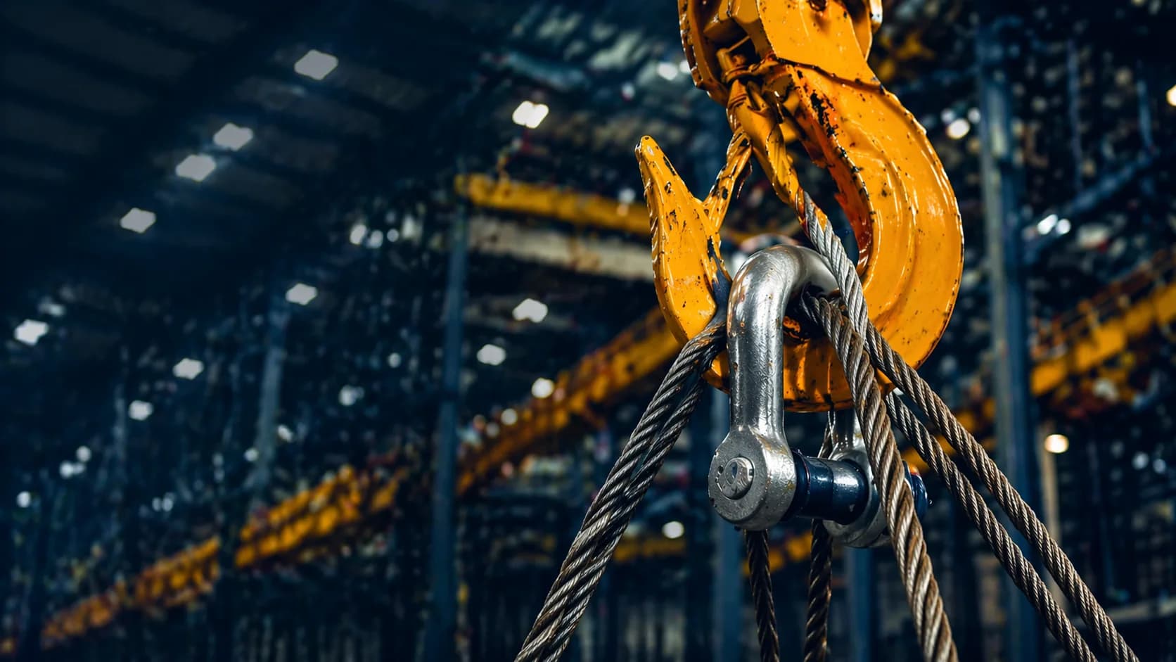 Industrial lifting equipment inside a large warehouse